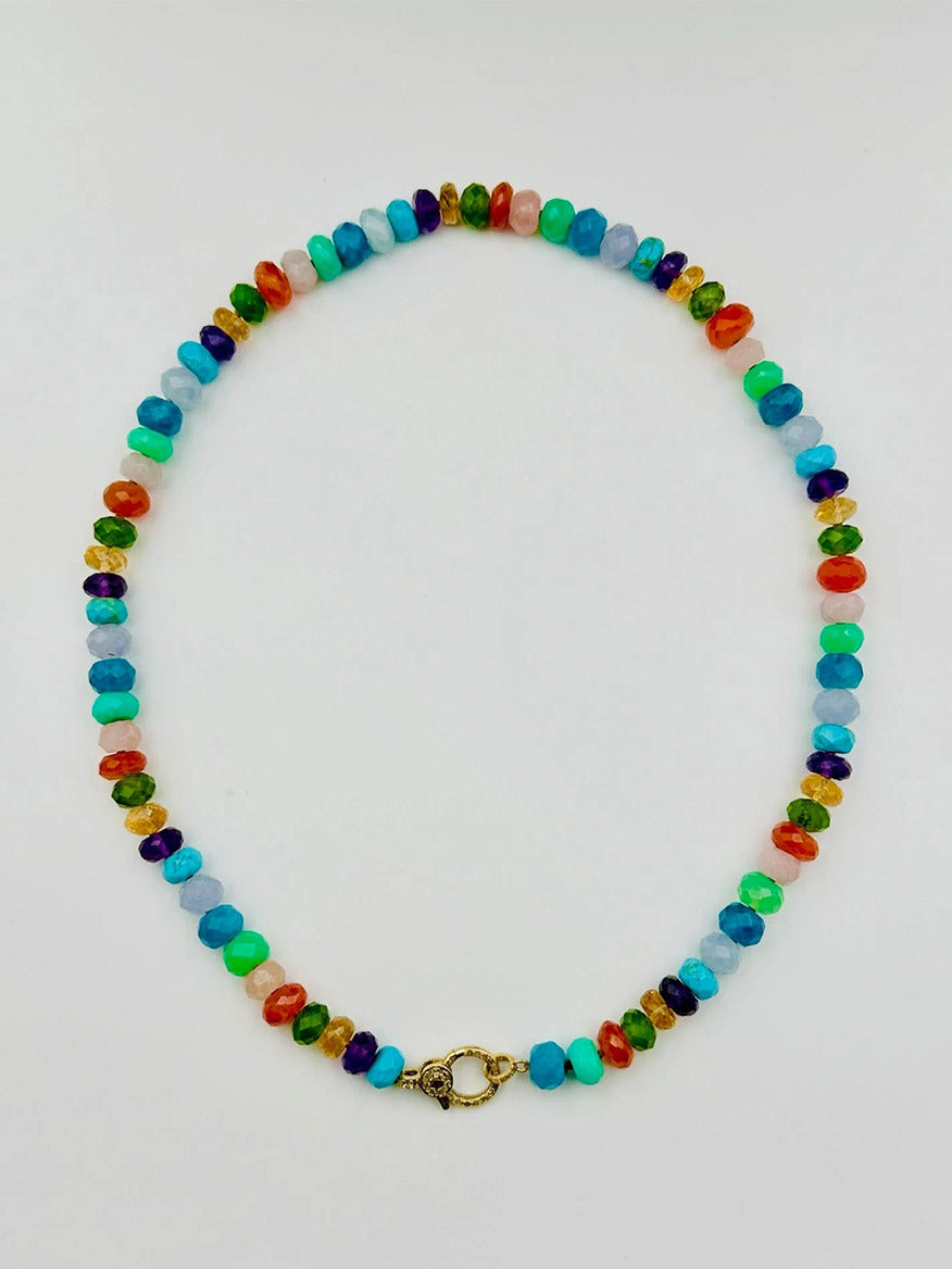 The JMNYC Designs Multi Faceted Rondel Necklace features multicolored oval beads and an 18" gold vermeil diamond clasp, arranged in a loop on a white background.
