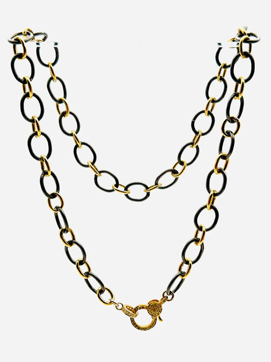 The JMNYC Designs Black Rhodium Oval Gold Vermeil Diamond Chain 18" features oval links and a decorative clasp, shown against a plain white background.