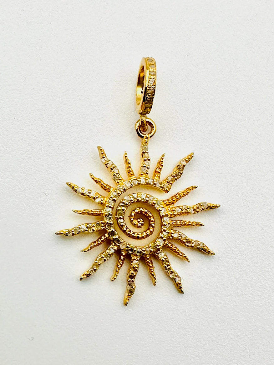 JMNYC Designs Gold Vermeil Pave Diamond Spiral Sun Pendant with a spiral center and textured rays, accented with small pave diamonds, shown on a plain white background.