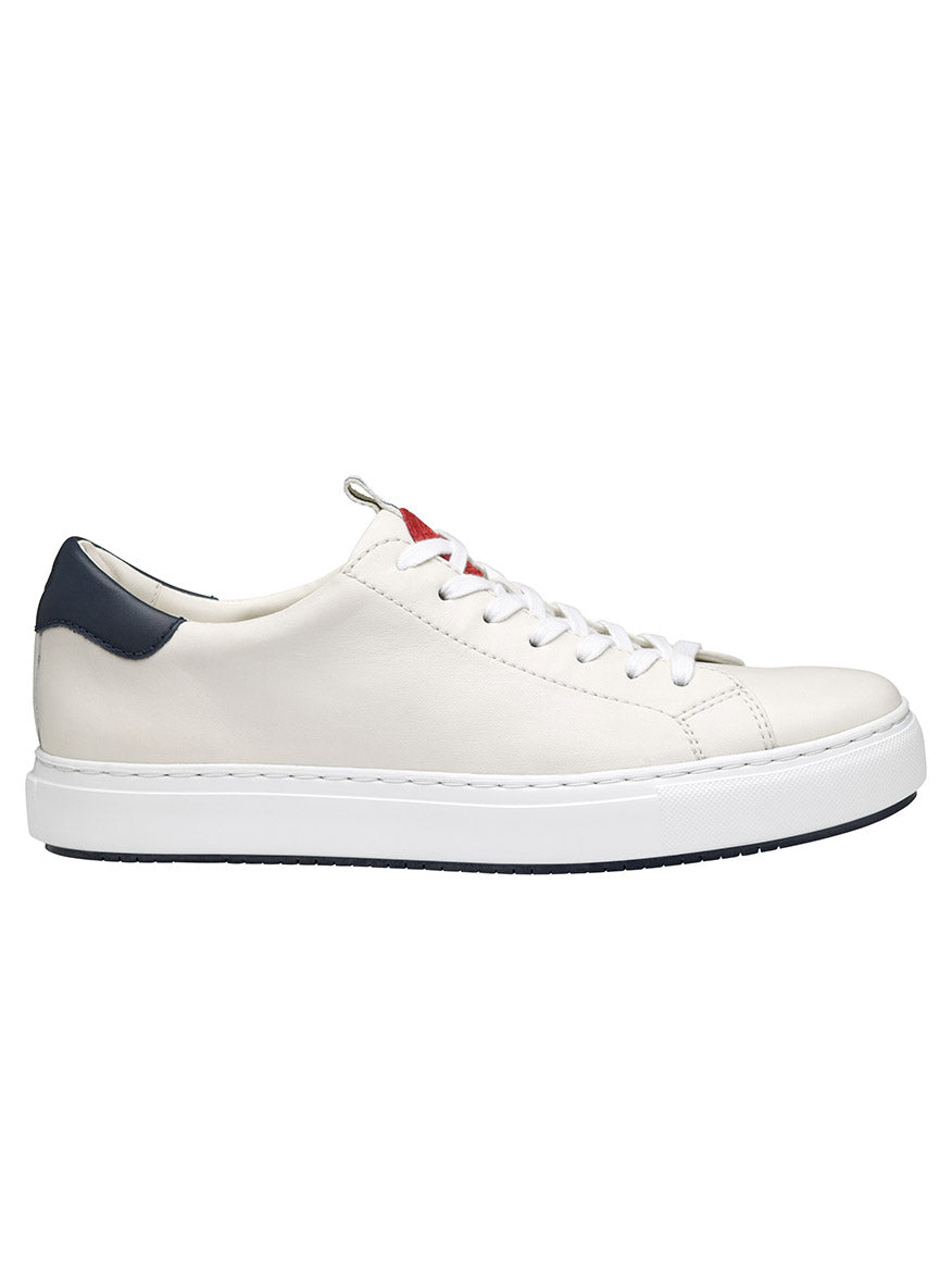 J & M Collection Anson Lace-to-Toe in White Sheepskin leather sneaker with navy blue accent on the heel and a red tab, displayed against a white background.
