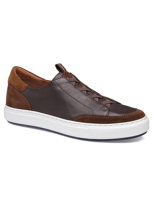 The J & M Collection Anson Stretch Lace-to-Toe in Dark Brown English Suede/Sheepskin features side stitching, brown laces, a cushioned EVA outsole, and a white rubber sole, shown at a three-quarter angle.
