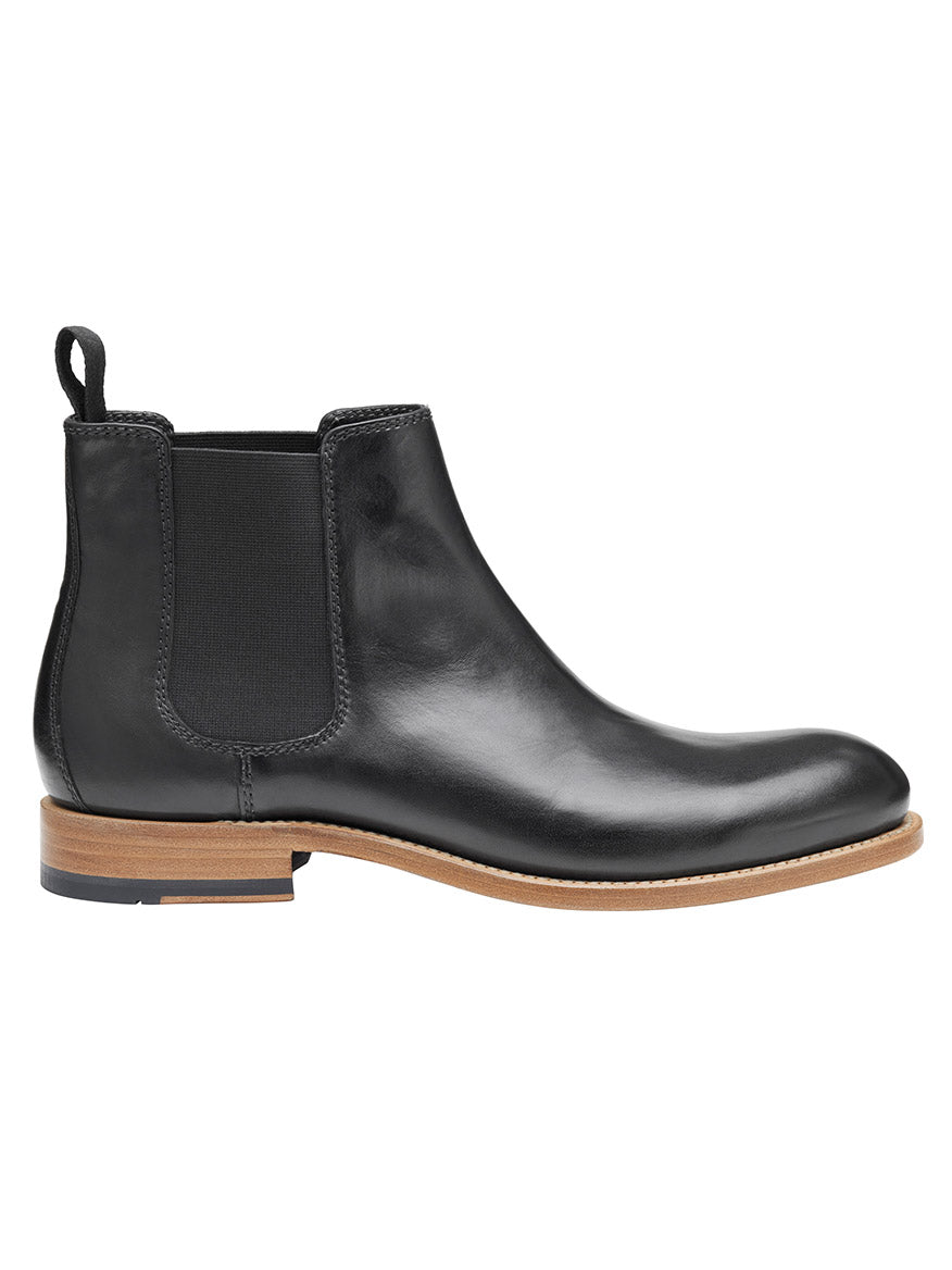 The J & M Collection Dudley Chelsea Boot in Black Dip-Dyed Calfskin features a brown sole, elastic side panels, and Goodyear welt construction.