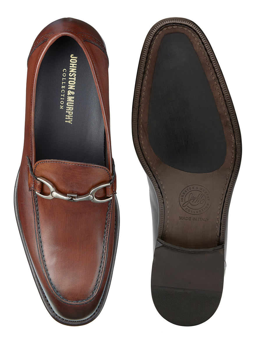 A pair of J & M Collection Ellsworth Bit in Brown Italian Calfskin, shown from the top and the sole. The shoes, crafted from Italian calfskin, feature a silver buckle detail and stitching accents, along with enhanced cushioning for comfort.