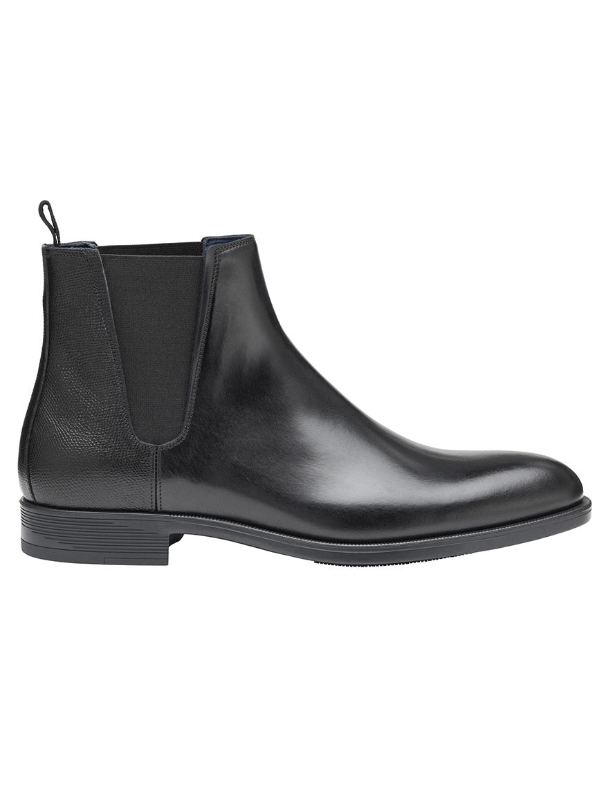 The J & M Collection Flynch Chelsea Boot in Black Italian Calfskin features elastic side panels, a pull tab at the heel, and is crafted from premium Italian calfskin.