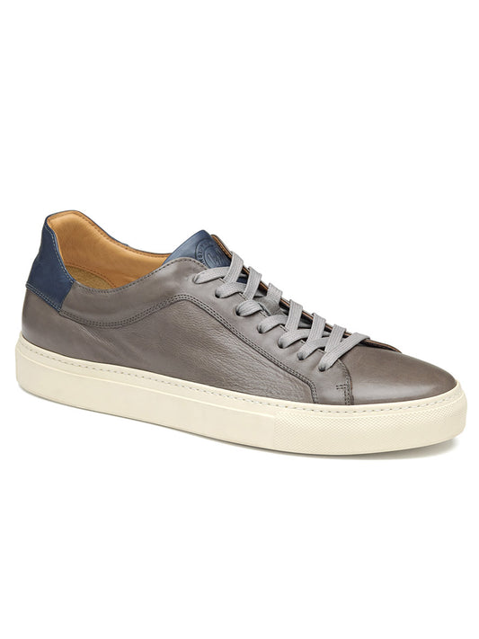 A single J & M Collection Jared Lace-To-Toe in Grey Italian Calfskin sneaker with blue details and white soles.