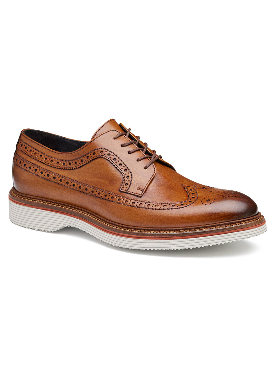 The J & M Collection Jenson Longwing in Tan European Calfskin features decorative broguing, a white EVA outsole, and lace-up closure, shown on a plain white background.