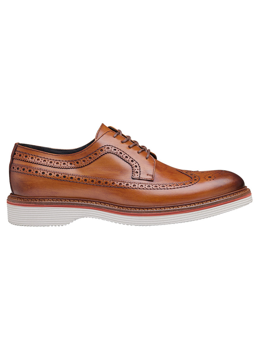 The J & M Collection Jenson Longwing in Tan European Calfskin features brown hand-stained leather, decorative perforations, lace-up closure, leather lining, and a contrasting white EVA outsole, shown here in a side view.