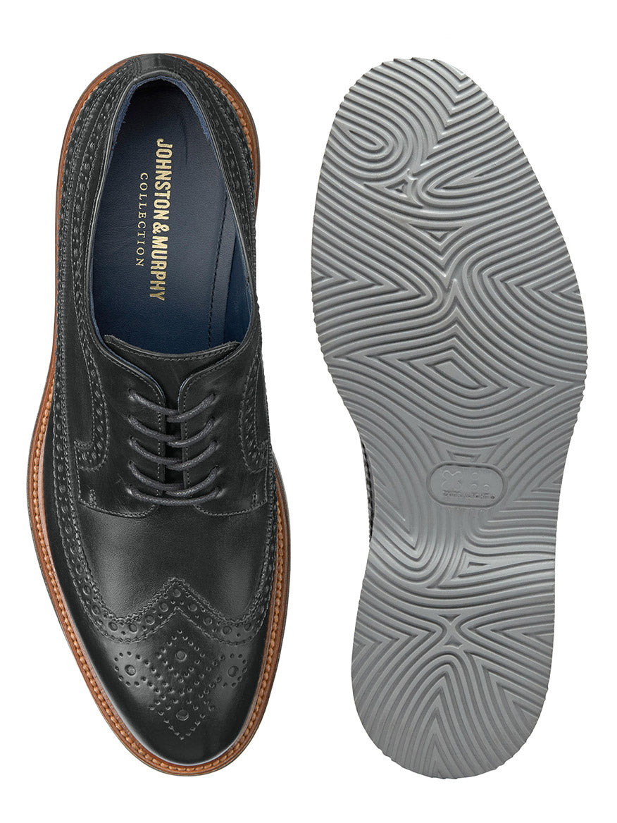 J & M Collection Jenson Longwing in Black Italian Calfskin by Johnston & Murphy, made from fine Italian calfskin, showing both the top and sole with intricate patterns. The cushioned footbed ensures comfort while the high abrasion EVA outsole offers durability and grip.