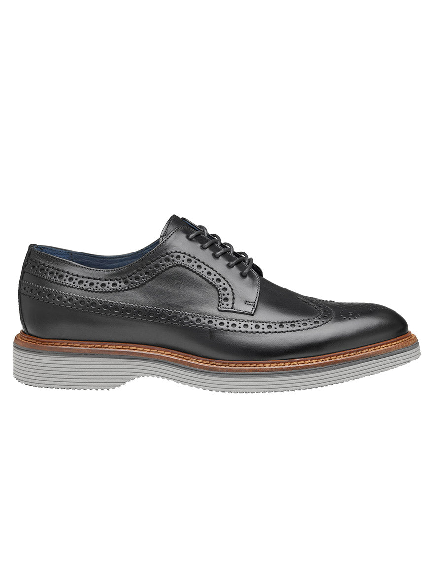 J & M Collection Jenson Longwing in Black Italian Calfskin with perforated detailing, brown welt, cushioned footbed, and a high abrasion EVA outsole. Side view.