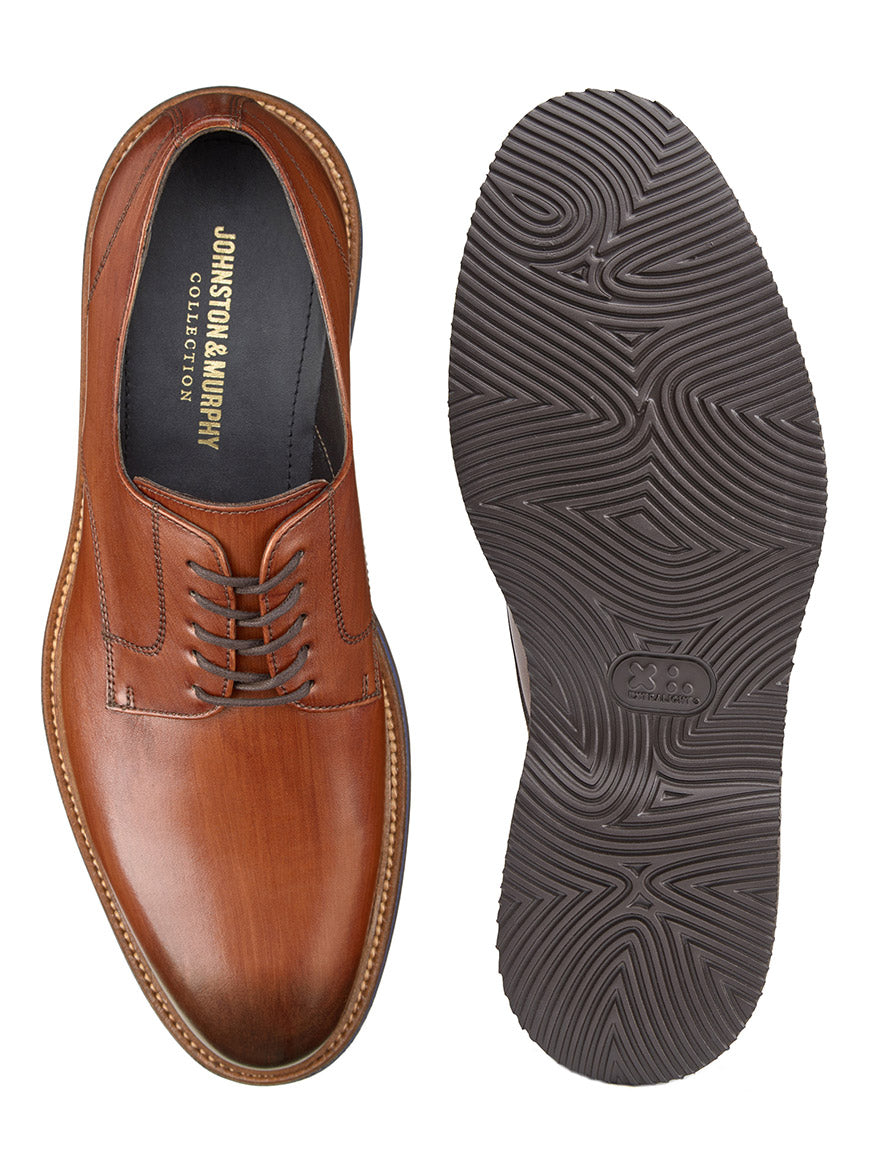The J & M Collection Jenson Plain Toe in Brown Italian Calfskin shoes, one shown from the top and the other showcasing the textured black rubber sole.