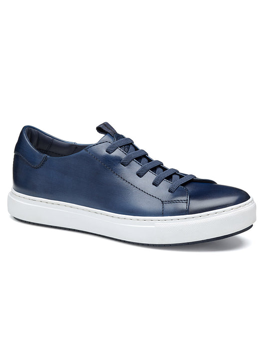The J & M Collection Anson Lace-to-Toe in Navy Hand-Stained Calfskin features a retro style with premium suede, dark laces, and a striking blue upper. It includes a flexible EVA sole for comfort, all set against an elegant white backdrop.