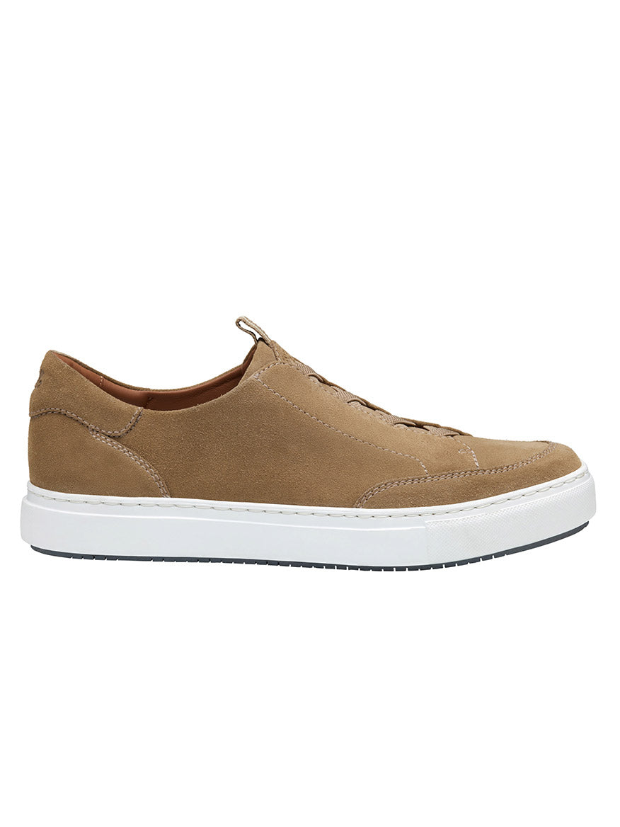 The J & M Collection Anson Stretch Lace-to-Toe sneaker showcases a retro-style design with tan taupe English suede, white laces, and a white rubber sole from the side view.