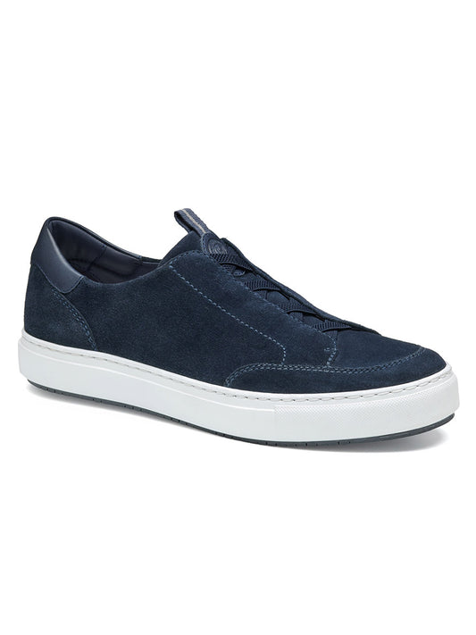 J & M Collection's Anson Stretch Lace-to-Toe sneaker in Navy English Suede features a cushioned footbed, white sole, and matching laces, viewed from the side.