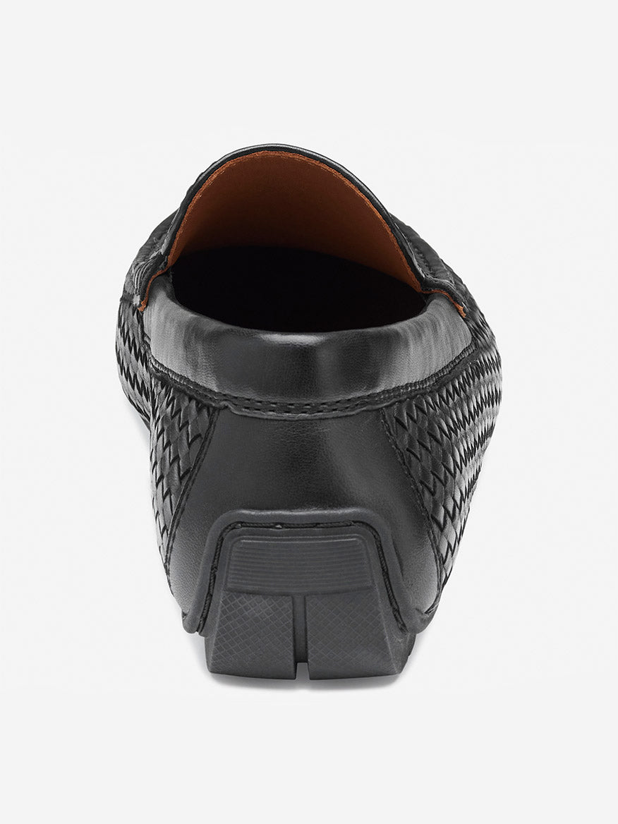 Rear view of the J & M Collection Baldwin Driver Woven Slip-On in Black Sheepskin, showcasing its detailed woven leather texture, rubber sole, and open heel design.