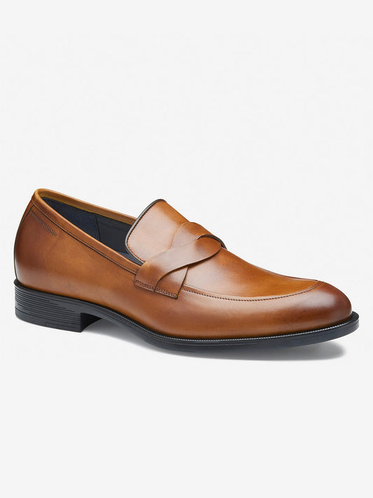 The J & M Collection Flynch Braided Strap Loafer features a sleek design in tan Italian calfskin, a low heel, and a braided strap on top for added style, complemented by a leather-covered footbed for comfort.