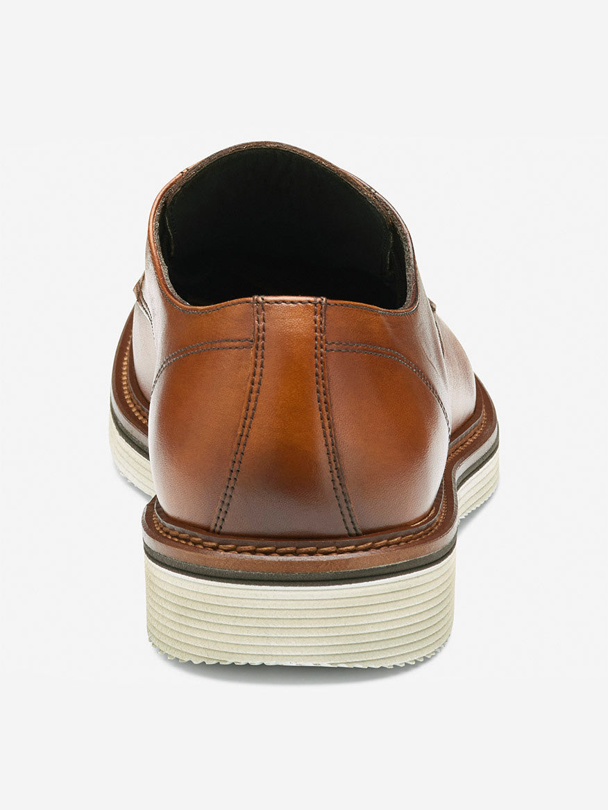 Rear view of the J & M Collection Jenson Plain Toe in Tan European Calfskin, featuring visible stitching, a leather-covered footbed, and a white EVA sole on a light gray background.