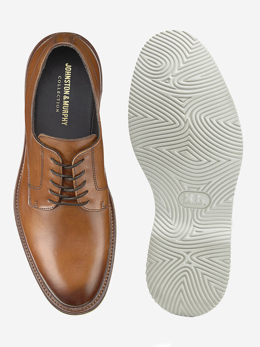 The J & M Collection Jenson Plain Toe in Tan European Calfskin features a brown leather exterior, black interior, and a white textured rubber EVA sole with lace-up design, shown from top and bottom views.