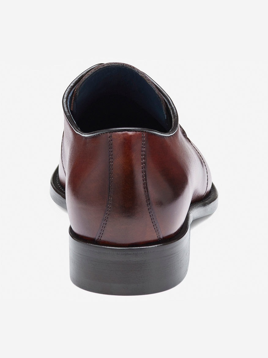 A single J & M Collection Larson 2-Eye Plain Toe in mahogany Italian calfskin is shown from the back, emphasizing its smooth finish and sturdy, dark heel.