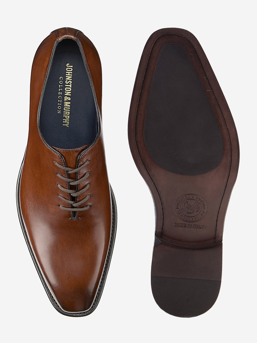 The J & M Collection Larson Plain Toe in Mahogany Italian Calfskin features a brown leather design with lace-up detailing and branding on the sole, which is inscribed with "Made in Italy.
