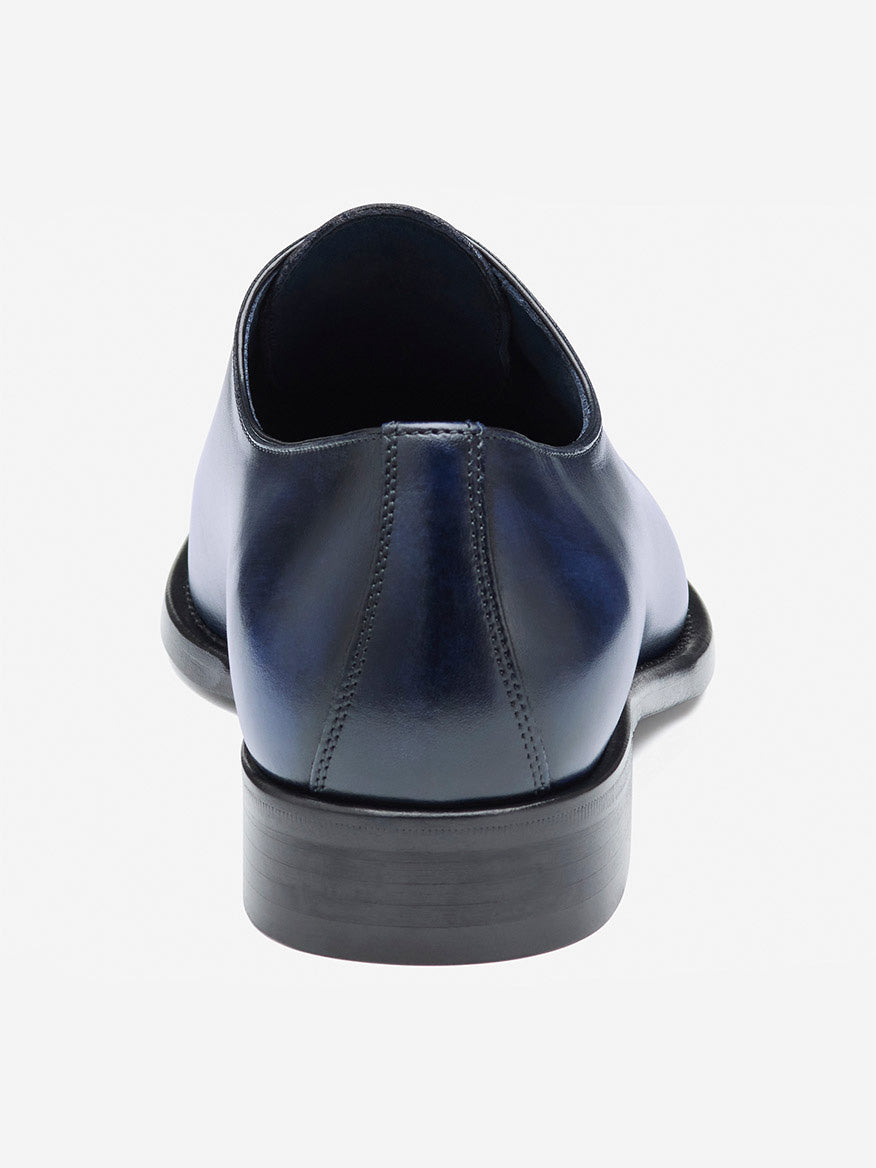 Back view of the J & M Collection Larson Plain Toe in Navy Italian Calfskin, showcasing the beautiful craftsmanship with intricate stitching and a black sole.