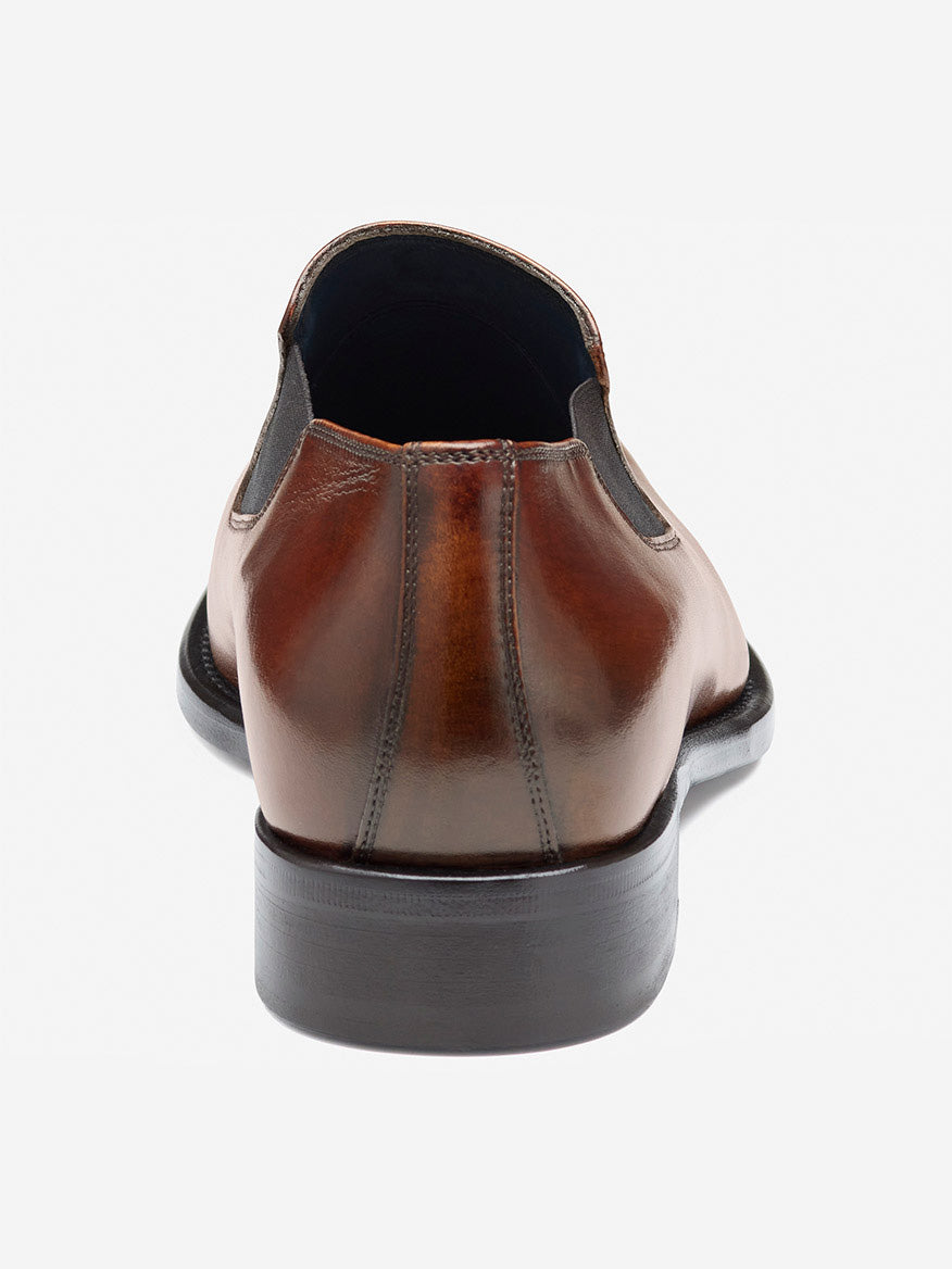Rear view of the J & M Collection Larson Slip-On in mahogany Italian calfskin, featuring intricate stitching and detailed heel craftsmanship against a white background.