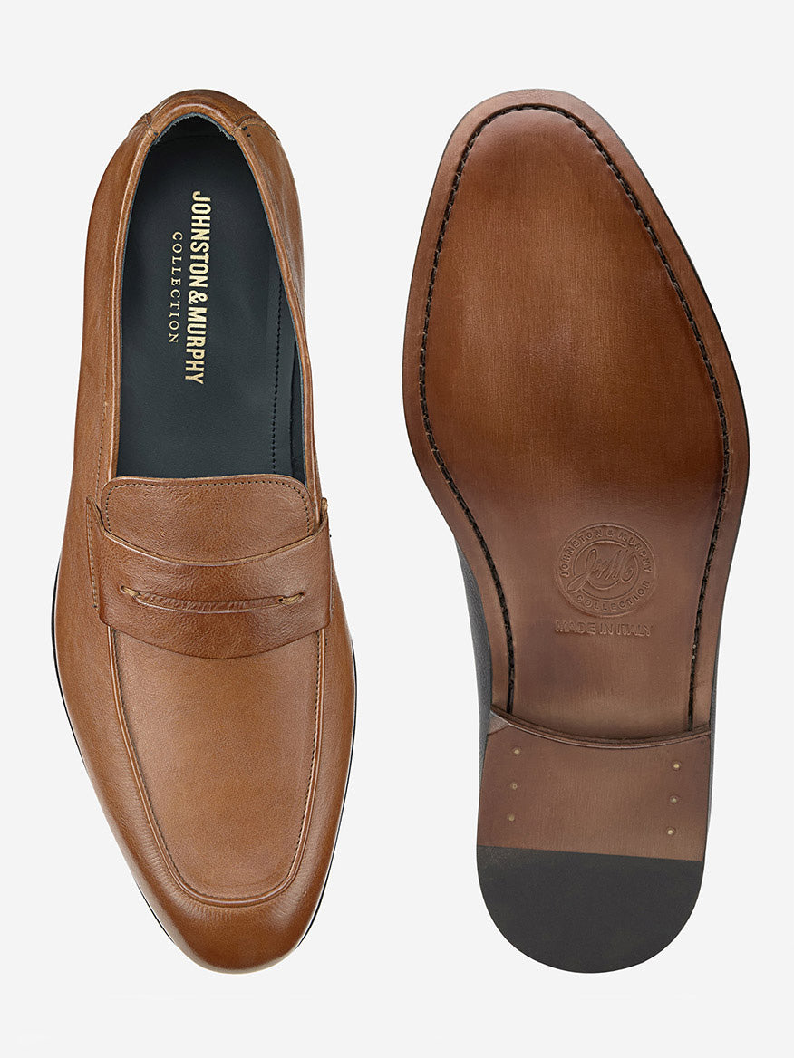 The J & M Collection Taylor Penny loafers in Tan Italian Full Grain are elegantly displayed with a top view on the left and a branded sole on the right. These classy shoes exemplify Italian craftsmanship and offer ultimate comfort with a luxurious leather-covered footbed.