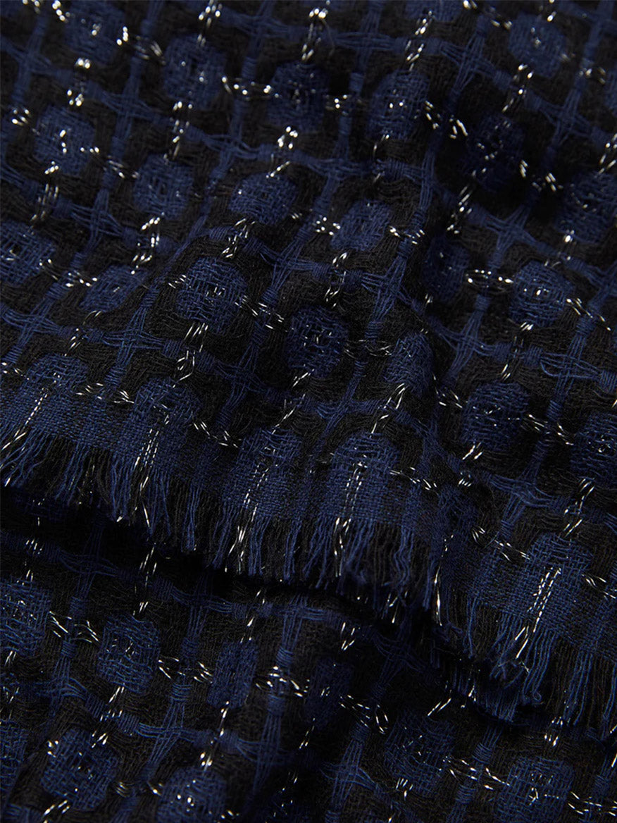 Close-up of Jane Carr The Tile Scarf in Black/Navy with a grid pattern and subtle sheen.