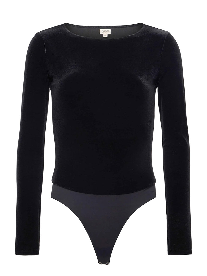The L'Agence Seraphine Velvet Bodysuit in Black features long sleeves, a round neckline, and a snap button crotch closure. Made in Los Angeles, it's shown on a white background.