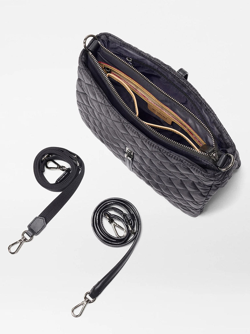 The MZ Wallace Astor Crossbody in Black Oxford is a quilted black bag with two detachable straps, crafted from Italian leather, and features an inner pocket and compartments.