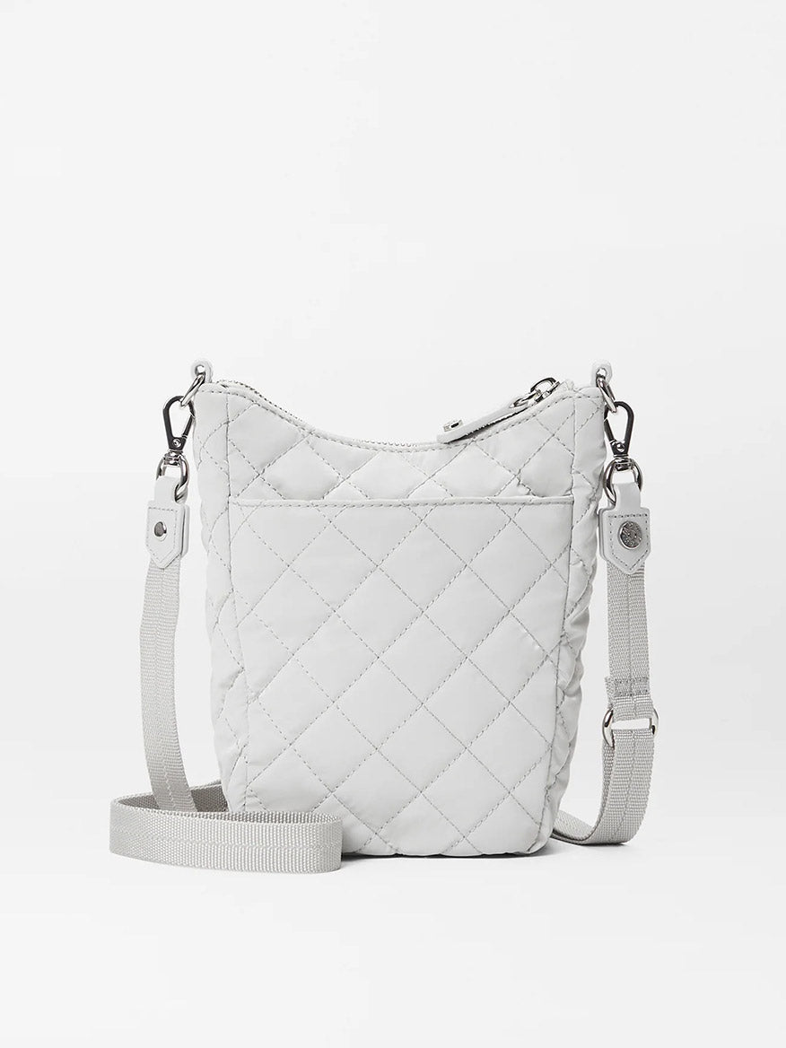 White MZ Wallace Crosby Go in Pebble Liquid Oxford with Italian leather trim and adjustable nylon crossbody strap on a plain background.