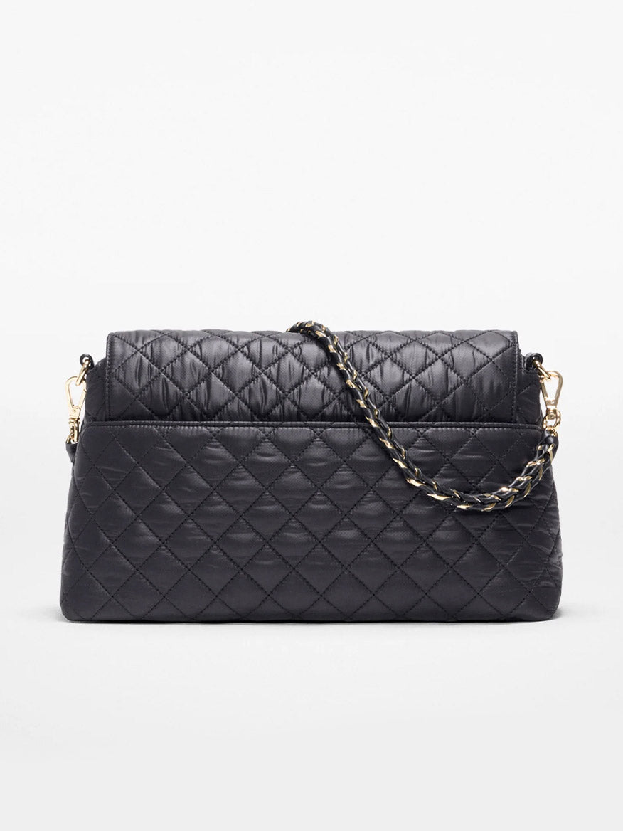 The MZ Wallace Crosby Lock Shoulder in Black Oxford features a black quilted design with a gold and black chain crossbody strap, crafted from Italian leather and shown against a plain white background.