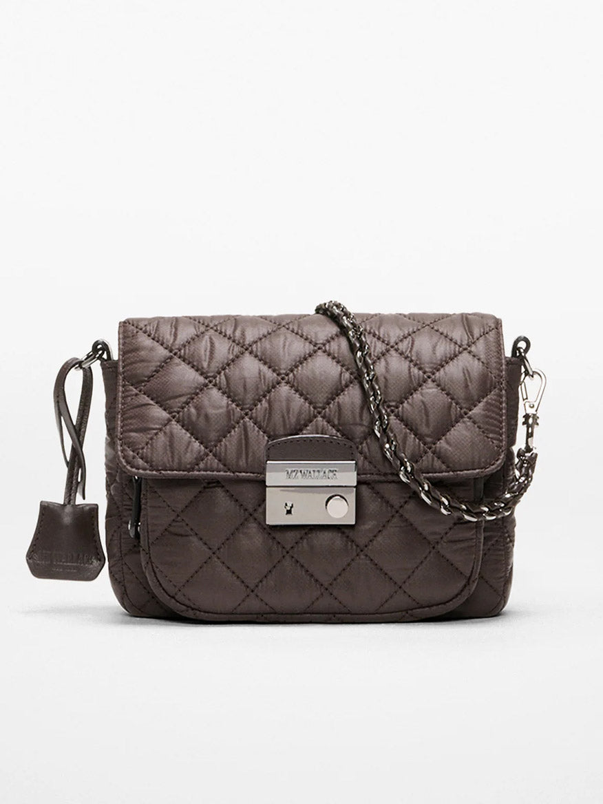 The MZ Wallace Crosby Lock Small Crossbody in Espresso Oxford features dark brown quilted fabric, a chain strap, silver-tone clasp closure, and a small pouch attached to the left side.