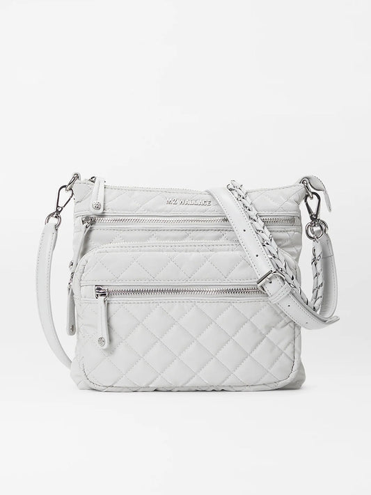 White quilted MZ Wallace Downtown Crosby in Pebble Liquid Oxford shoulder bag with silver hardware, zippers, and a detachable pouch on a white background.