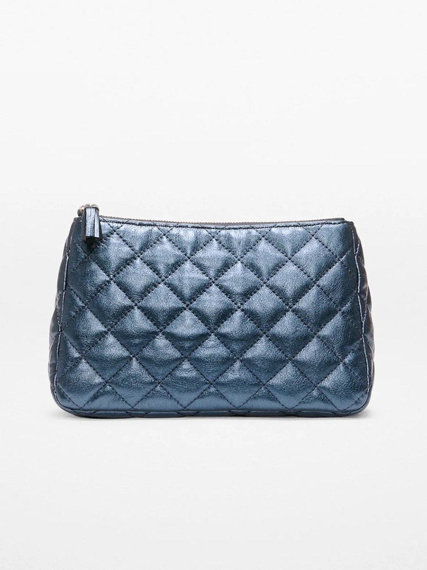 The MZ Wallace Medium Luna Cosmetic in Midnight Metallic Leather features a quilted metallic blue finish, light gold hardware, and a zipper closure, shown against a plain white background.