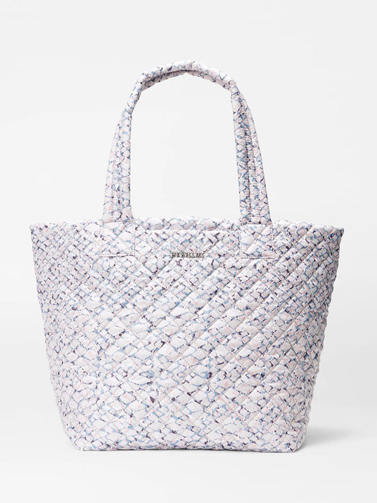A textured light-colored MZ Wallace Medium Metro Tote Deluxe in Summer Shale Oxford crafted from REC Oxford fabric, displayed on a white background.