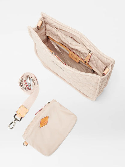 Beige quilted MZ Wallace Metro Box Crossbody in Mushroom Oxford with an open top view, displaying the inner compartments and a detachable crossbody strap on the side.