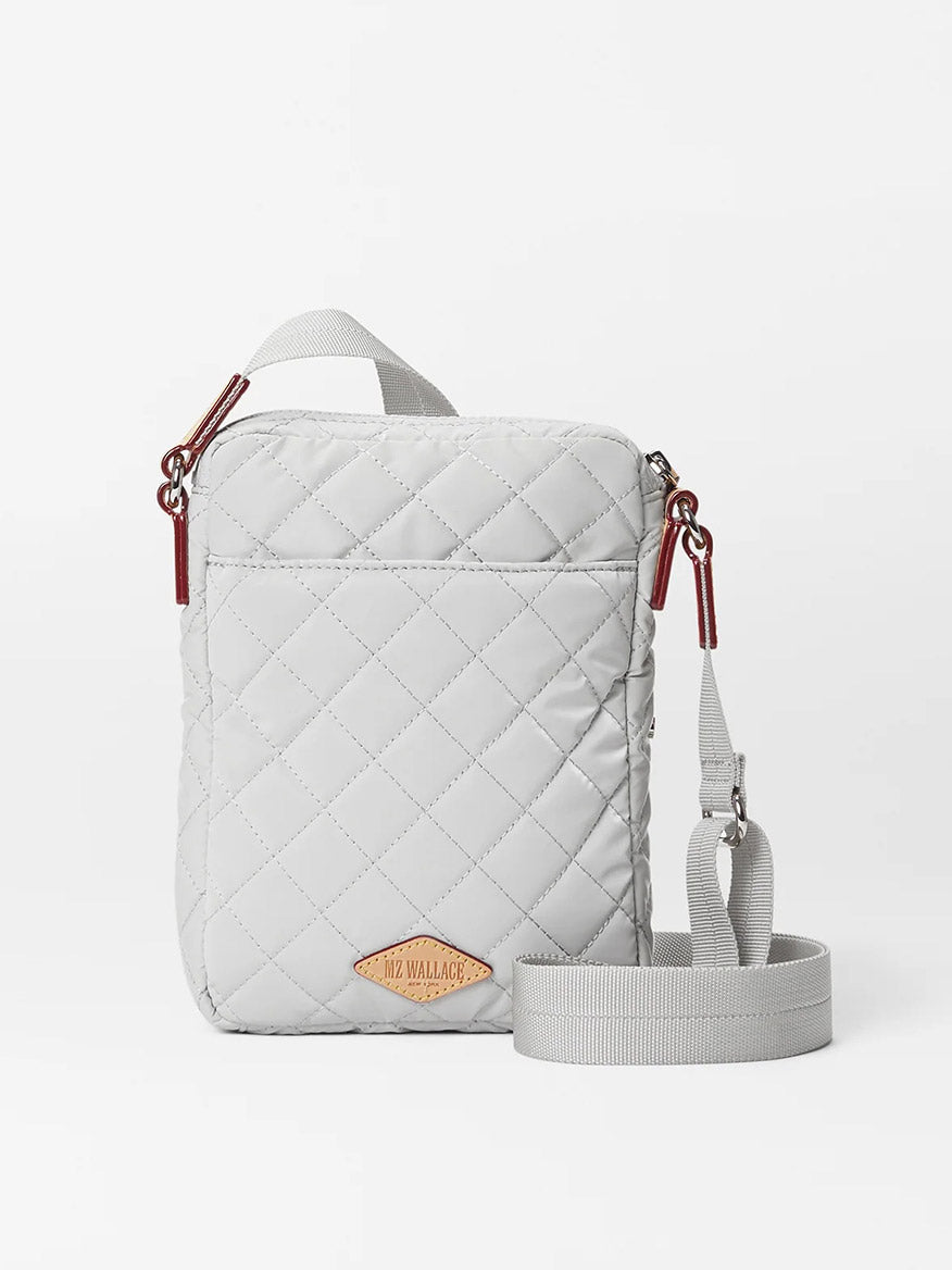 Quilted white MZ Wallace Metro Crossbody in Pebble Liquid Oxford with an adjustable crossbody strap and brand label on lower front.