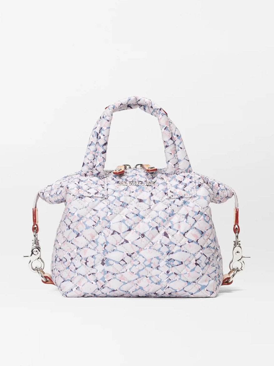 Patterned MZ Wallace Micro Sutton in Summer Shale Oxford with metallic clasps and a crossbody strap on a white background.