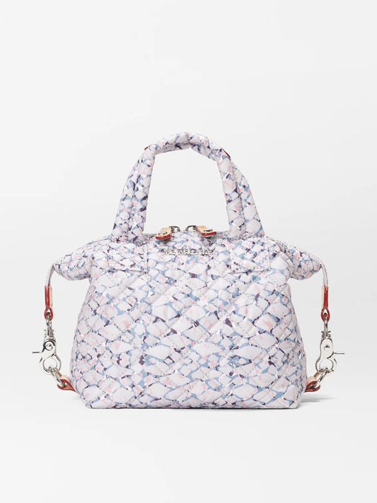 Patterned MZ Wallace Micro Sutton in Summer Shale Oxford with metallic clasps and a crossbody strap on a white background.