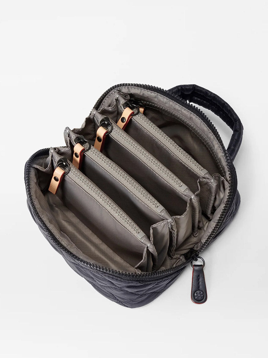 The MZ Wallace Mini Accordion Jewelry Case in Black Oxford is a small, zippered case with multiple gray interior compartments, dividers, and handy pockets, shown open from above.
