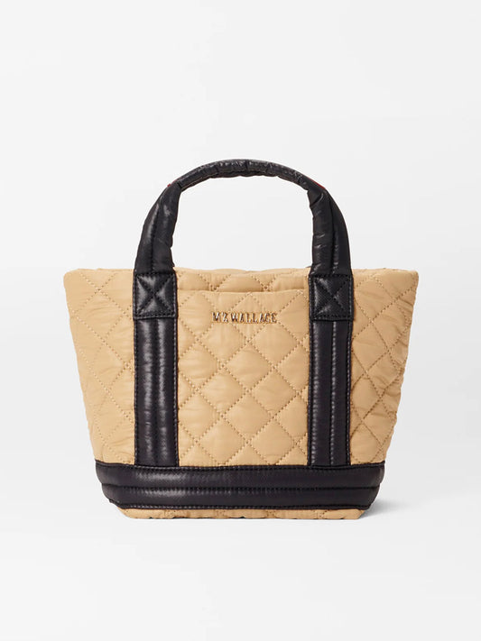 Camel and black quilted MZ Wallace Mini Empire Tote with padded nylon handles on a white background.