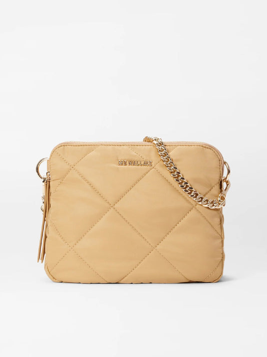 A beige MZ Wallace Quilted Madison Crossbody in Camel Bedford with a gold chain strap and zipper, displayed against a white background.