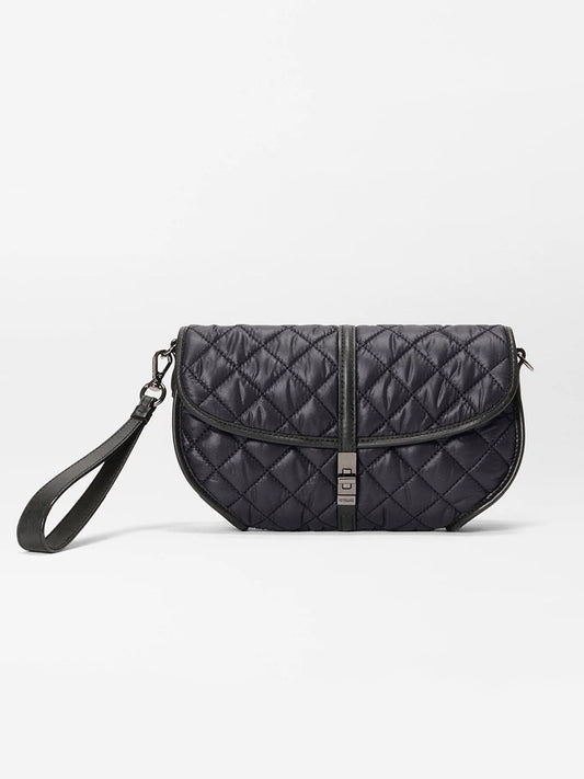 The MZ Wallace Small Astor Convertible Clutch in Black Oxford features a quilted design, flap closure with metal clasp, and detachable wrist strap, shown against a plain white background.