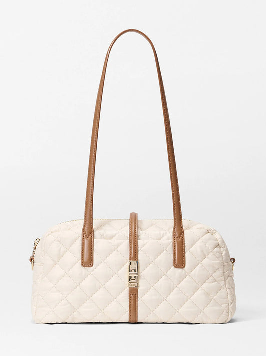 The MZ Wallace Small Astor Satchel in Sandshell Oxford with Brown features rectangular quilted nylon, beige panels, Italian leather trim, long brown straps, and a gold clasp detail, shown against a plain white background.