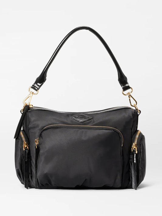 A MZ Wallace Small Chelsea Crossbody in Black Bedford diaper bag with a gold zipper, featuring an adjustable crossbody strap.