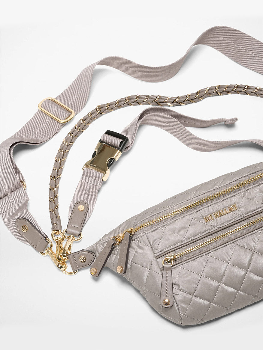 The MZ Wallace Small Crosby Sling Bag in Sable Pearl Metallic Oxford features gold zippers and hardware, a quilted design, a wide adjustable strap, and a braided strap.