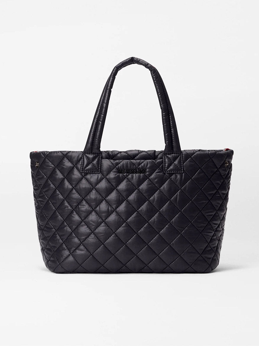 The MZ Wallace Small Metro City Tote in Black Oxford features a quilted exterior and two handles, shown against a plain white background.