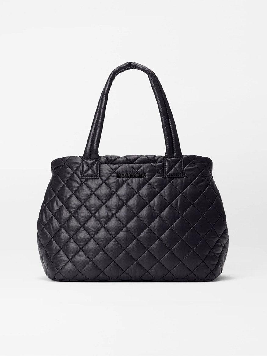 MZ Wallace Small Metro City Tote in Black Oxford, featuring a quilted exterior and two handles, is displayed upright against a plain white background.