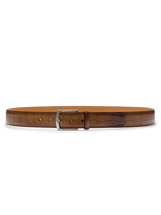 A Magnanni Grabar Belt in Cuero, featuring a brown calfskin leather with an alligator-embossed pattern and a silver buckle, laid out flat.