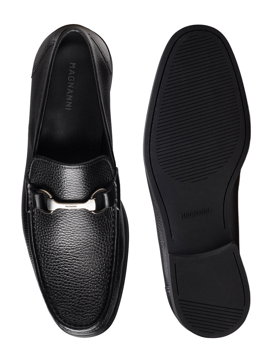 Magnanni Gentry Soft in Tumbled Black: black leather moccasin loafers with a textured finish, featuring a silver bit buckle detail and cushioned rubber soles. Includes top and bottom views.